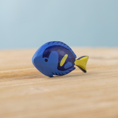 Royal Blue Fish wooden toy on a light wooden surface
