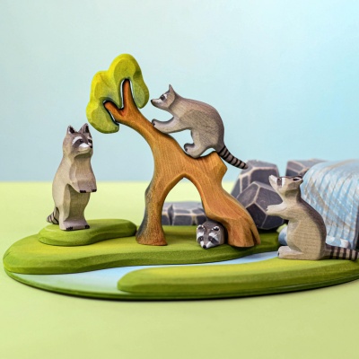 Playful arrangement of Wooden Sitting Raccoon and other animals