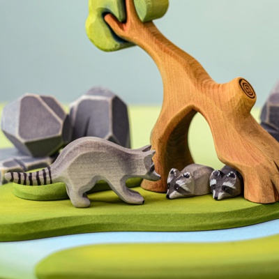 Wooden raccoons and tree play set