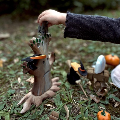 The raven being used in a counting or sorting activity with other small animal toys.