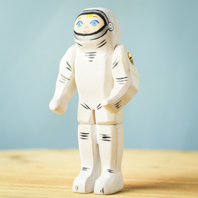 Close-up of a smiling astronaut figure in a space suit.