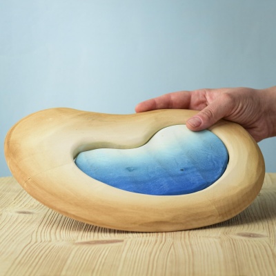 Savanna Lake toy being held in hands to show its size and craftsmanship.