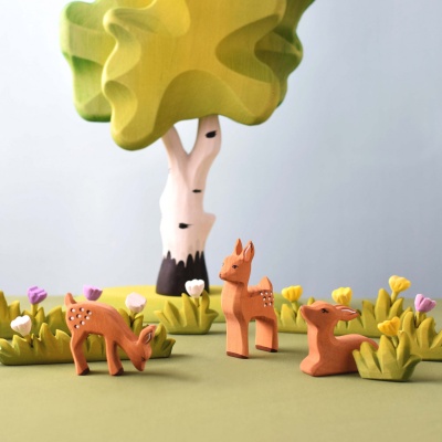 Heirloom-quality wooden stag and deer for natural play.