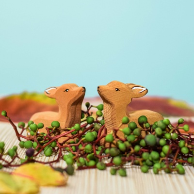 Artisan-crafted fawn figures, encouraging environmental learning.