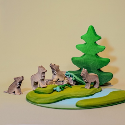 Wooden wolves from Bumbu Toys in a naturalistic play setting