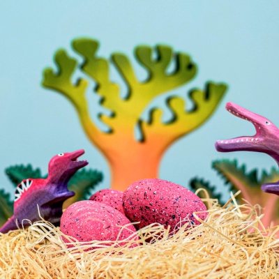 Play scene with Wooden Spinosaurus Eggs and dinosaur toys