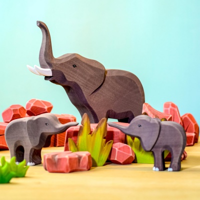BumbuToys presents a family of elephants exploring the rocky savanna landscape