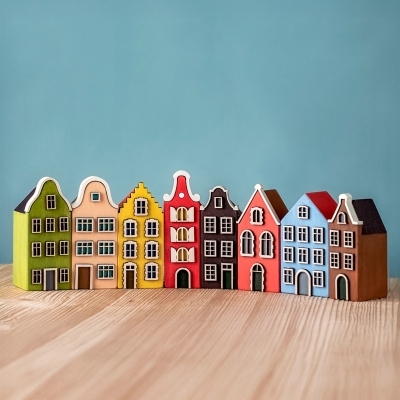 Row of European-style wooden houses on wooden table.