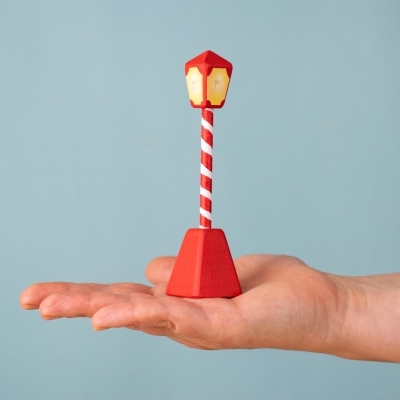 Wooden Christmas Lamp Post shown in hand for scale.