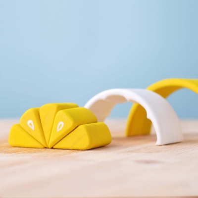 Bright and engaging wooden lemon wedges by BumbuToys, perfect for creative play.