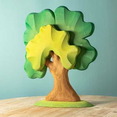 The Large Green Oak by BumbuToys, standing tall with a canopy of hand-painted green leaves.