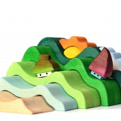 Teach about the wonders of the earth with BumbuToys' Mountains, Cloud, and Sun toy.