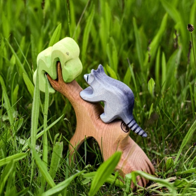 Close-up of wooden raccoon figures