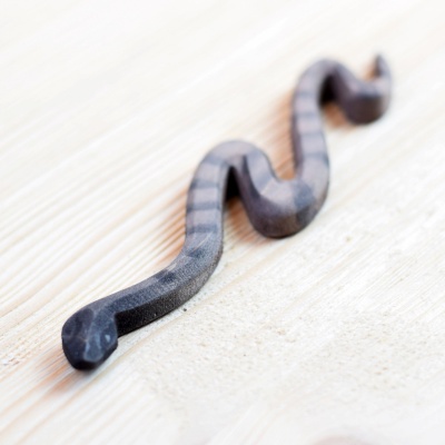 Wooden Snake figure from BumbuToys, showcasing exquisite craftsmanship and natural patterns