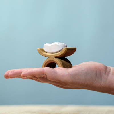 Sustainable wood figurine of Jesus Child in crib, by BumbuToys