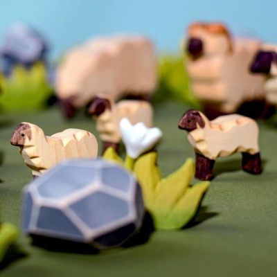 The shepherd figurine photographed beside other BumbuToys folklore characters.