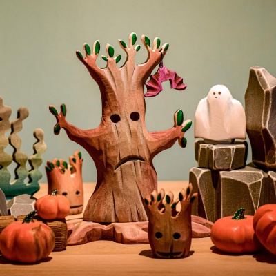Tall Spooky Tree Big figurine by Bumbu Toys in a dimly lit setting