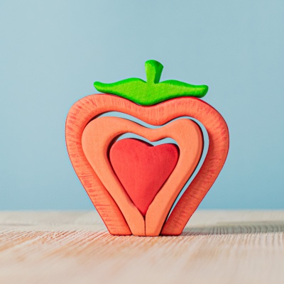 A love-filled strawberry toy by BumbuToys, perfect for playful learning.
