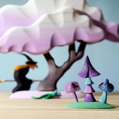 Whimsical BumbuToys wooden witch, ready to cast spells with her broom