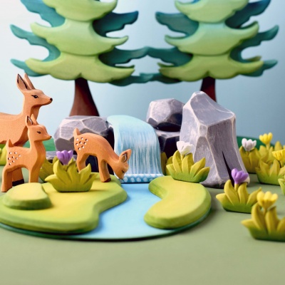 Wooden wildlife figures of deer herd from Bumbu Toys.