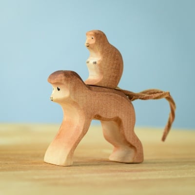 Handmade Monkey with Baby Monkey wooden toy on a wooden surface.