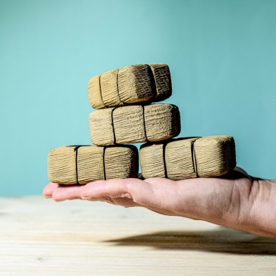 Textured wooden blocks from BumbuToys' Straw Bales SET, designed for creative building