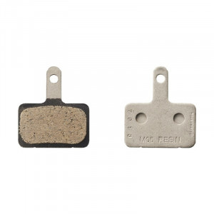 Placute frana pe disc Shimano resin M05, fara aripioare de racire, pad spring, 1 pereche, ambalat ind.