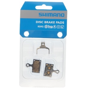 PLACUTE DE FRANA SHIMANO K04S, METAL, FARA ARIPIOARE DE RACIRE, CU ARC, 1 PERECHE, AMBALAT IND