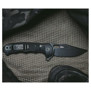 Cutit pliabil SOG SEAL XR Serrated 12-21-05-57, lama Clip Point CPM S35VN Black TiNi Partial Serrated, XR Lock, Flipper, maner GRN Black, Made in USA - Img 9
