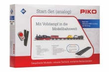PIKO 57123 Analoge startset: Goederentrein, Stoomlok, vijf goederenwagens, railovaal MET bedding, trafo en regelapparaat