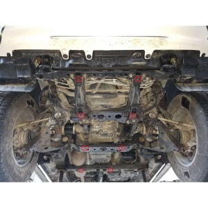 Puncte de fixare evidențiate sub un Toyota Hilux Revo pentru montarea scutului de radiator.