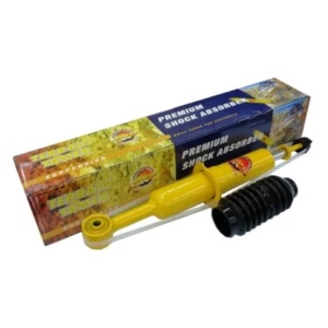 Un amortizor galben din kit, alături de ambalajul său individual.