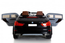 BMW X7 Dvosed za decu na akumulator sa kožnim sedištima i mekim gumama - Crni - Img 3