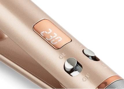 A close-up of a hair straightener
AI-generated content may be incorrect.