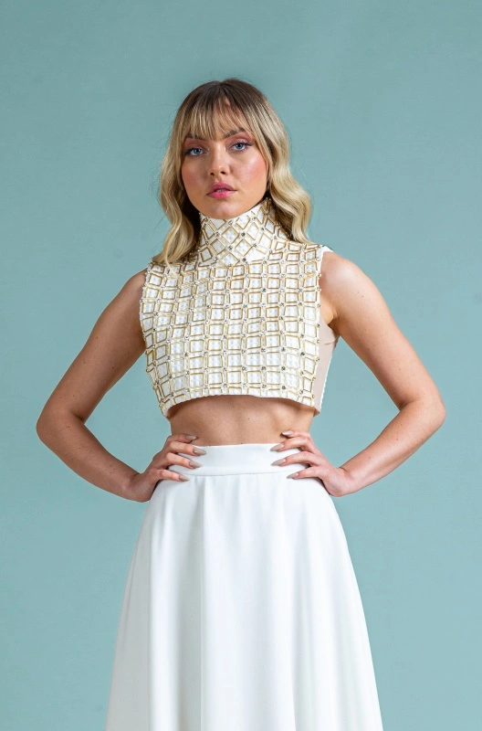 Sleeveless blouse with high collar and handmade precious inserts Ada