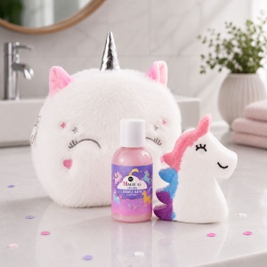 MAGICAL UNICORN children's bath set by Accentra, in a plush toiletry bag; includes strawberry-scented bubble bath and bath bomb.