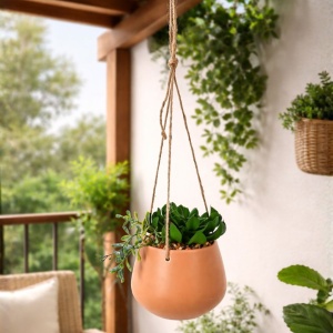 Artificial hanging plant with a mix of succulents, in a 16 cm orange ceramic pot, with a twine hanger.