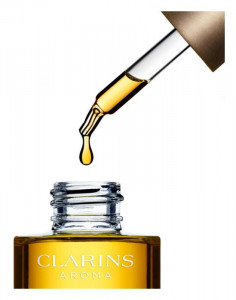 Ulei ulei de regenerare cu efect de netezire pentru fata Clarins Lotus Treatment Oil 30ml - Img 2