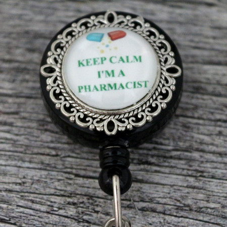Accesoriu retractabil pentru ecuson negru cu mesaj pentru farmacist