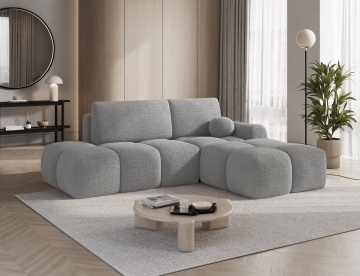 colțar Vittario gri Royal 04 cu pernă rotundă decorativă în living luminos