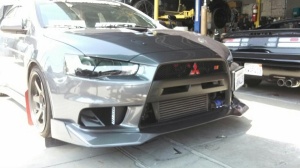 Mishimoto 08-15 Mitsubishi Lancer Evolution X Oil Cooler Kit, Silver - Img 1