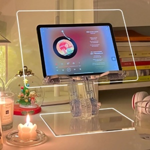 Clear foldable acrylic stand holding a 15.6″ laptop