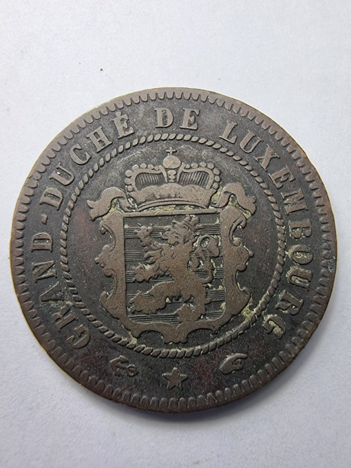 5 Centimes - Marele Ducat de Luxemburg, emisă în anul 1855, în timpul domniei lui Guillaume III (William al III-lea, rege al Olandei și mare duce de Luxemburg).