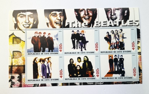 Bloc filatelic emis de Republica Côte d’Ivoire în anul 2003, dedicat formației legendare The Beatles.