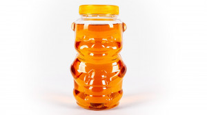 Borcan tip ursulet din plastic transparent cu capac galben - 1000gr