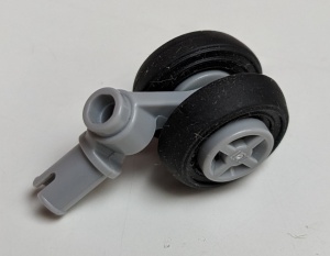 61483c01-86G Technische pin met dubbele wielhouder en lichtblauwgrijs wiel en gladde band grijs, licht (blauwachtig) gebruikt *0D0000