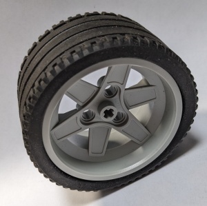 44772c01-9G Wiel 56mm/34mm Technic Racing Midden met band 68,8x36ZR (44771) (PAKKETZENDING) lichtgrijs (klassiek) gebruikt *5W000