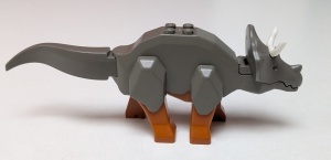 tricera03-10 Triceratops met donkeroranje benen en witte hoorns (PAKKETZENDING) donker, grijs (klassiek) NIEUW *