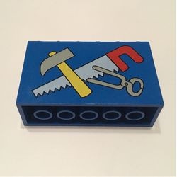6213px1-7G Steen 2x6x3 met hamer, zaag en tang patroon blauw gebruikt *5V000