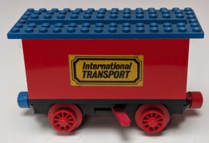 3443c04pb02-5G Batterijbox wagen 'International TRANSPORT" rood gebruikt *
